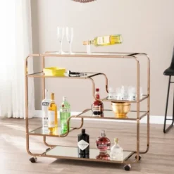 Kitchen Islands & Bar Carts-Kirkland's Home Gold Curved Metal Mirrored Bar Cart