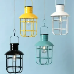 Outdoor Lighting-Kirkland's Home Hanging Cage Solar Powered Lantern Yellow